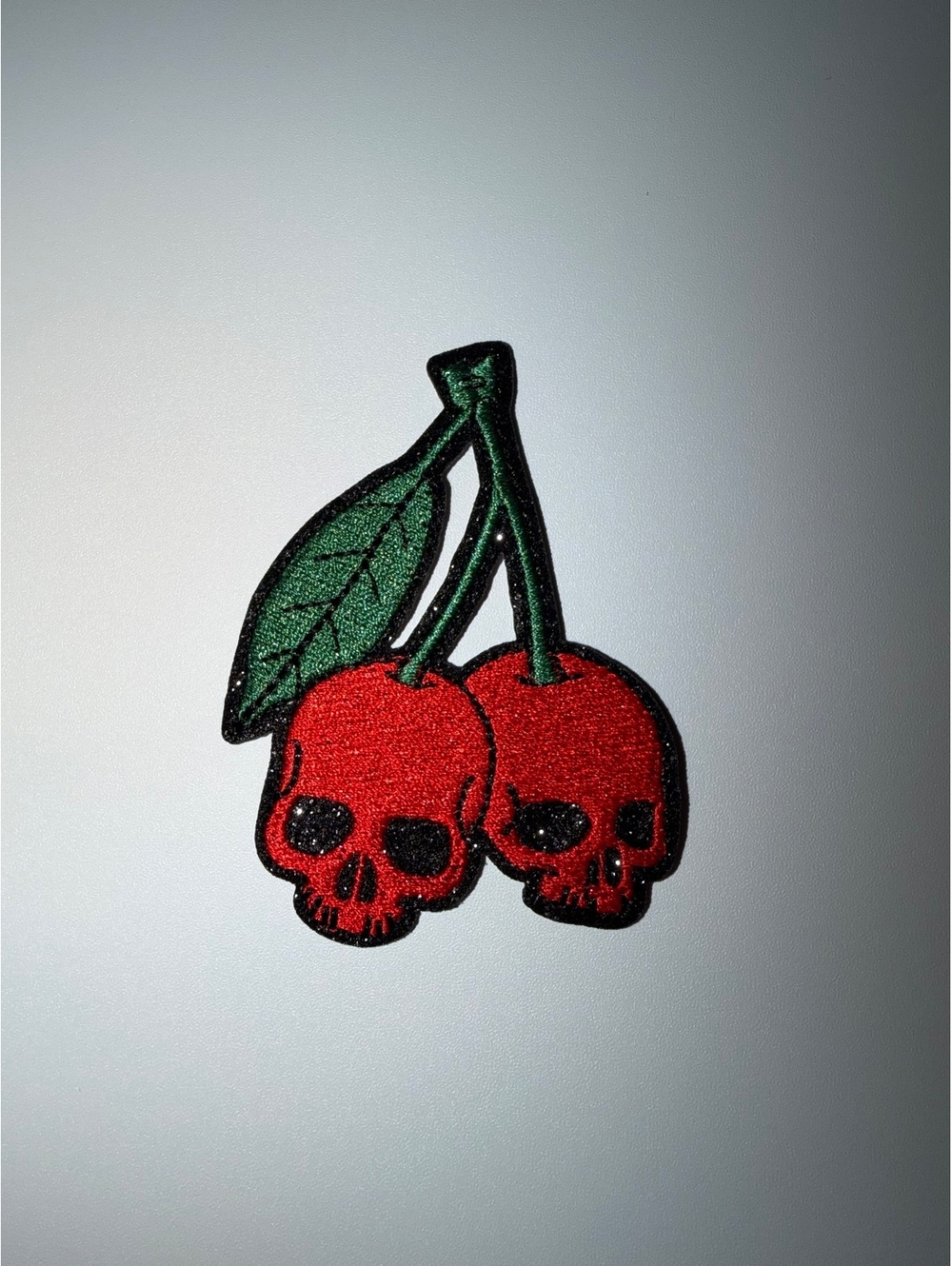 Red skull cherries patch with green stems and leaves #goth #alternative